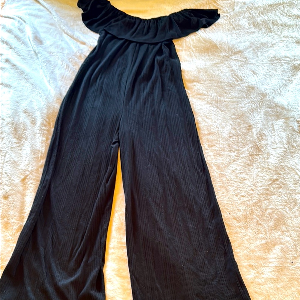 Black Off-Shoulder Jumpsuit with Wide-Leg Design.
